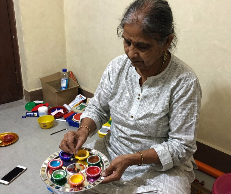 A close-up of a smiling artisan woman weaving vibrant fabric by hand in a sunlit workshop.