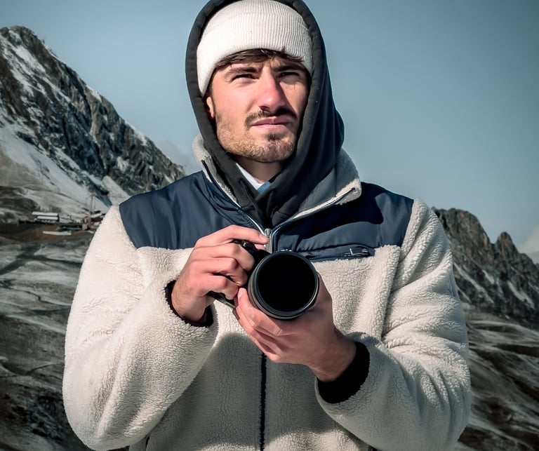 a man in a white jacket and a camera