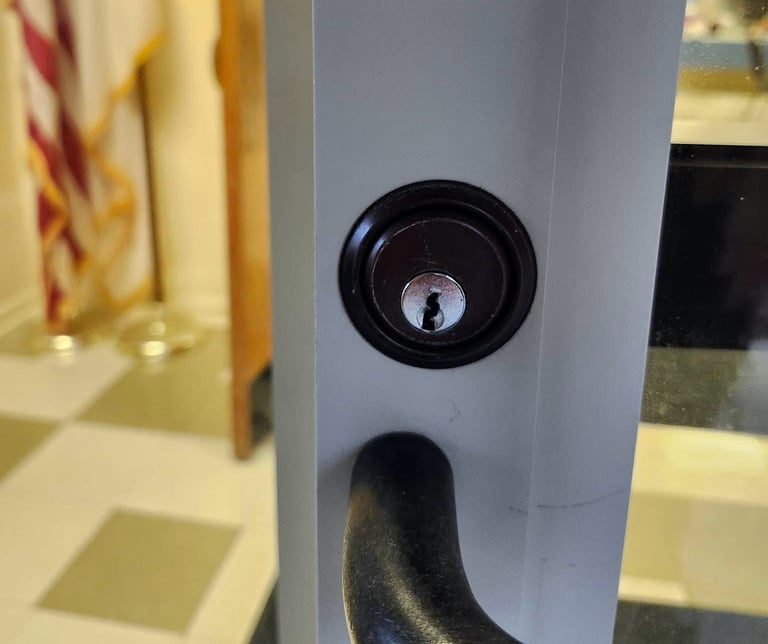 Close up of black lock on a business door representing inexpensive local locksmith of Mars Hill commercial services