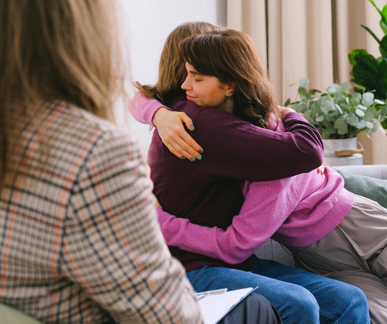Two people hugging after therapy breakthrough