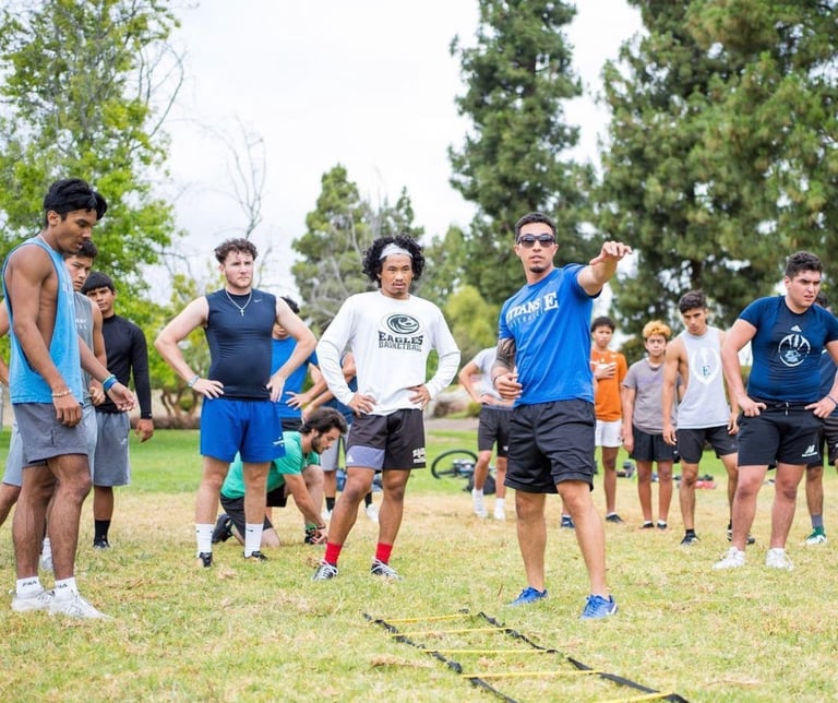 a man in a blue shirt is standing in a field