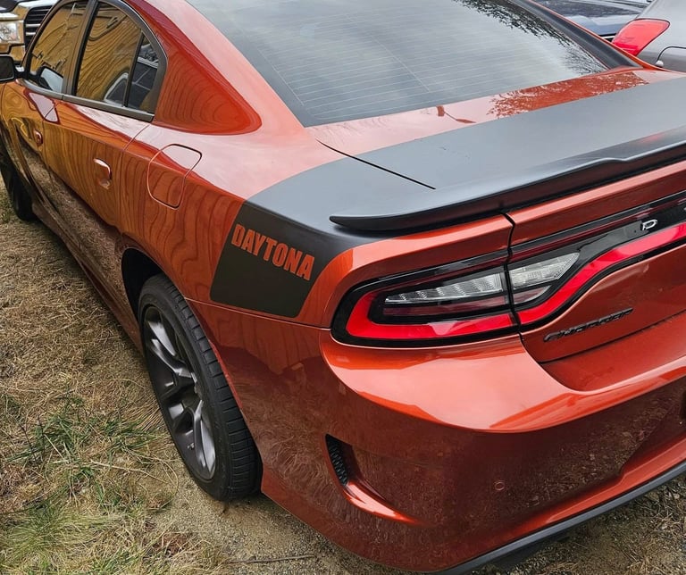 Orange Dodge Charger representing sports car auto Lovksmith local to Canton, NC
