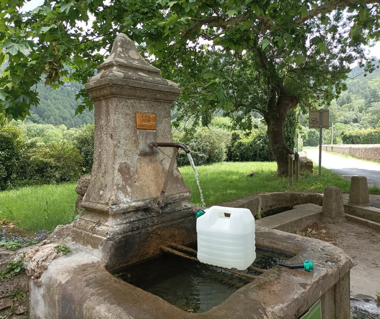Collecting water from the village fontaine