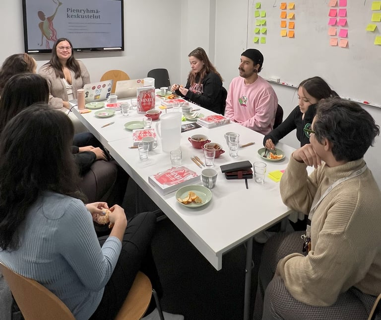 a group of people sitting around a table