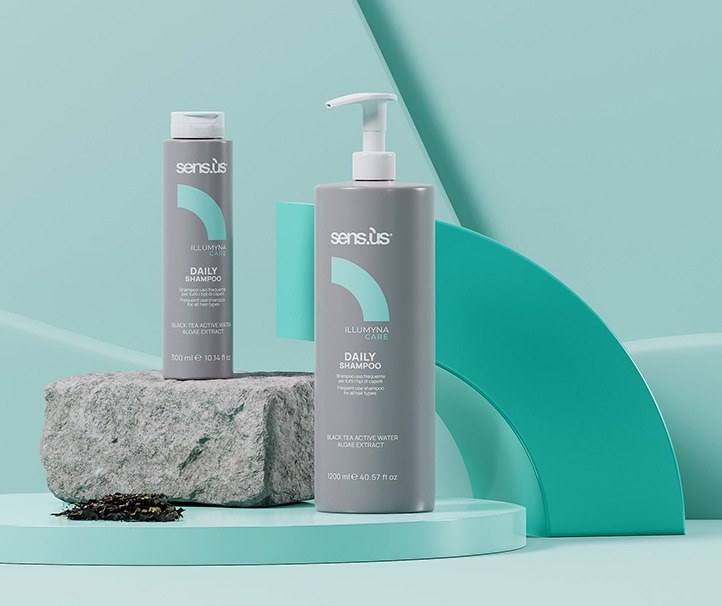 two bottles of hair care products on a table