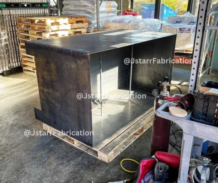 a unfinished metal planter box getting repaired