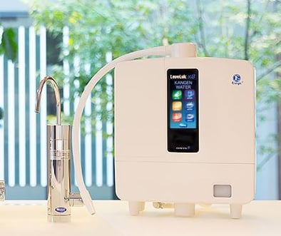 Enagic Leveluk K8 Kangen Water ionizer placed on a white counter featuring a large full LCD panel
