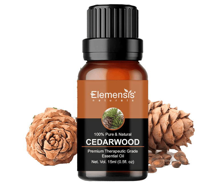 Cedarwood pinecones next to Cedarwood therapeutic grade essential oil bottle