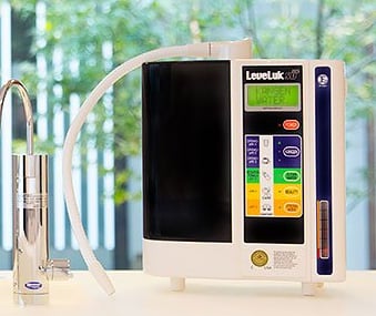 Enagic Leveluk SD501 Kangen Water ionizer on countertop featuring 7 platinum-plated titanium plates