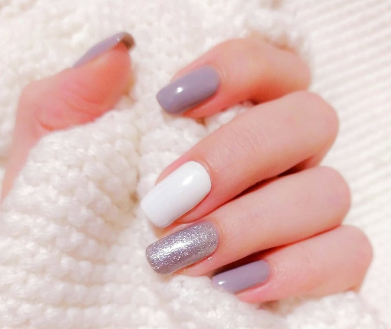 a woman's hands with a manicured manicured manicured manicured mani