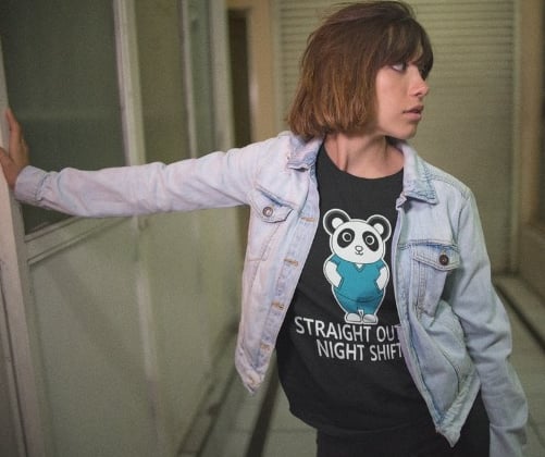 a woman in night shift nurse t-shirt