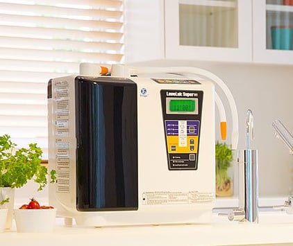 Enagic Super 501 Kangen Water ionizer on countertop featuring 7 & 5 platinum-plated titanium plates