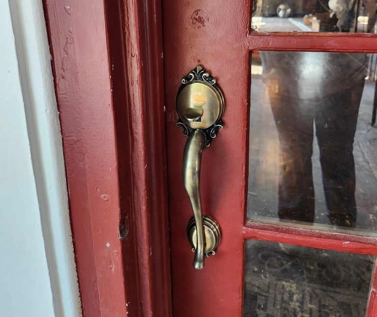 Red antique door with gold locks representing residential and commercial trusted Jack’s locksmith services
