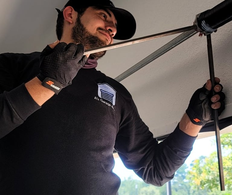 Alex Hernandez a garage door technician installing a new spring for a garage door