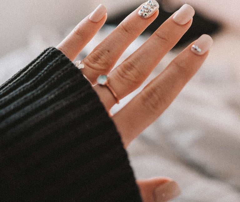 a woman's hand with a ring on her finger