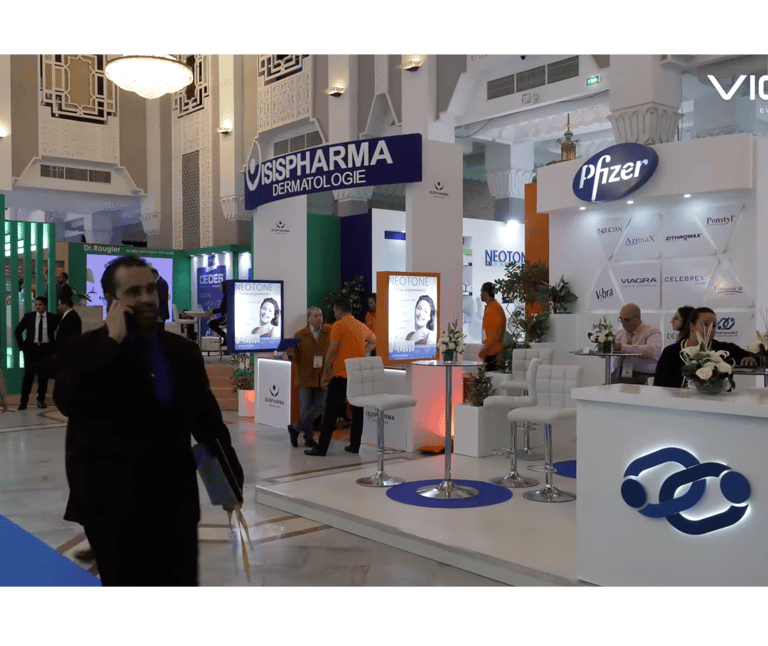 a man in a suit and tie dyes a tie on a white counter