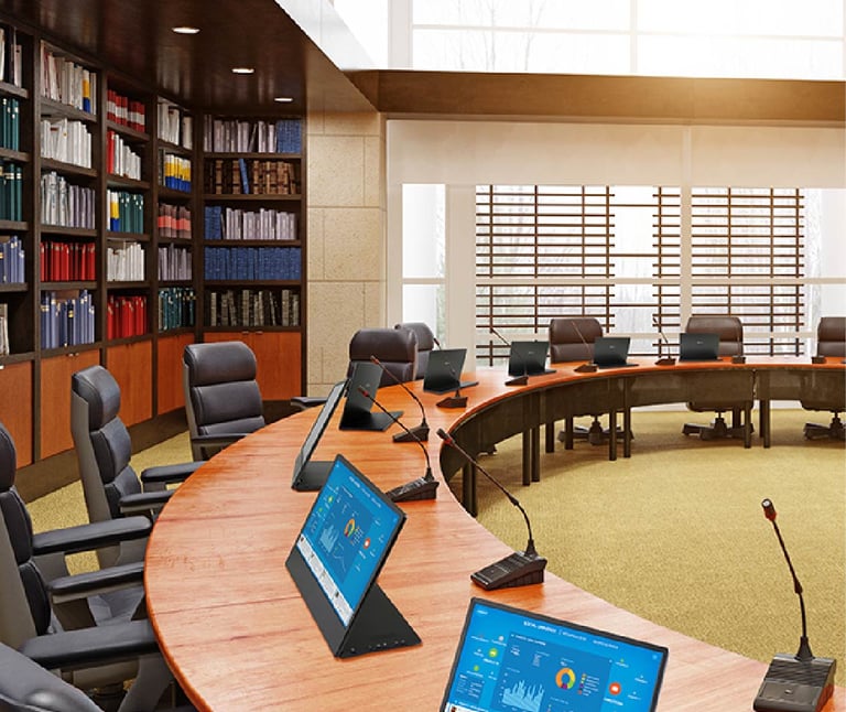 Conference microphone system and AV setup with PTZ cameras, dual displays, and professional audio routing for hybrid meetings