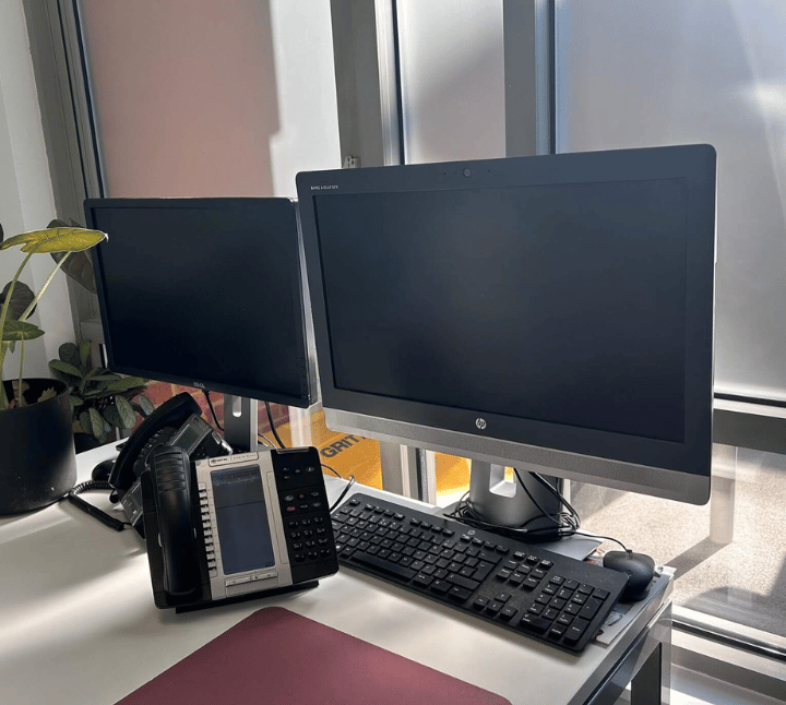 a desk with a phone phone and a phone