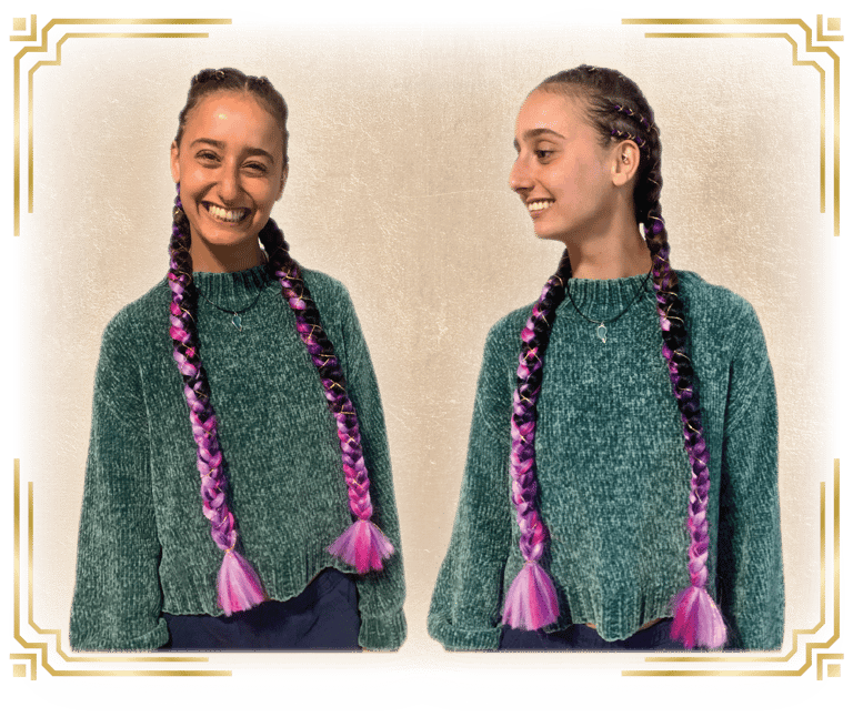 a woman with her hair done for a festival with braids and cornrows