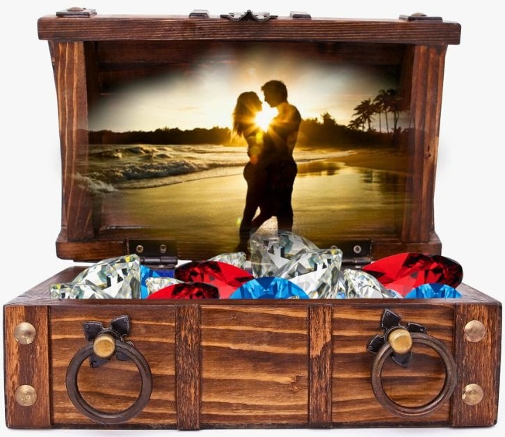a wooden chest with red, white and blue gems with a photo of a couple hovering above