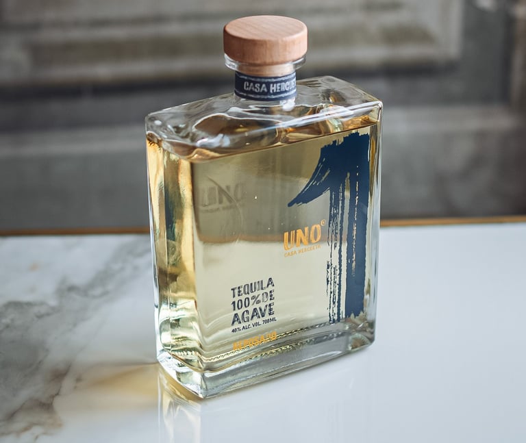 a bottle of Tequila Uno Reposado - premium tequila reposado