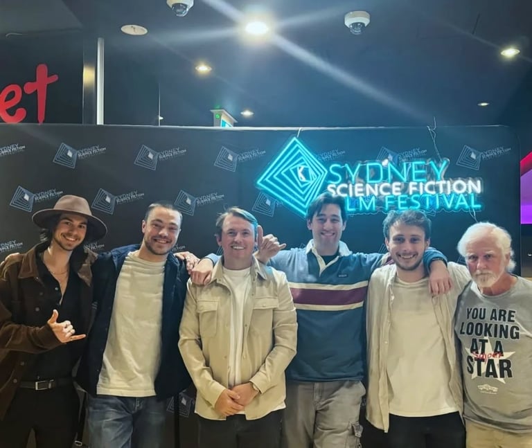 a group of people standing around a man in a hat