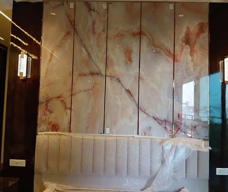 a bathroom with a marbled bathtub and a large mirror