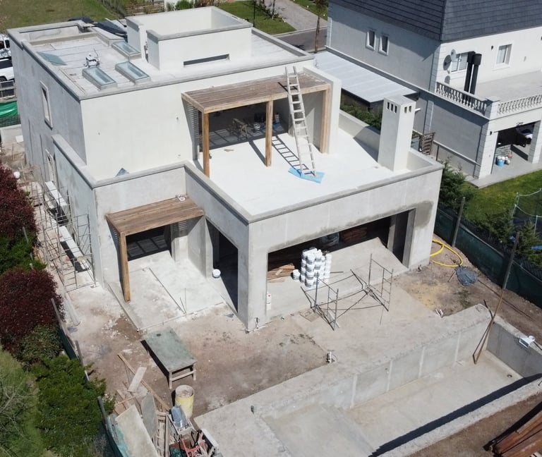 a house with a large roof and a pool in the foreground