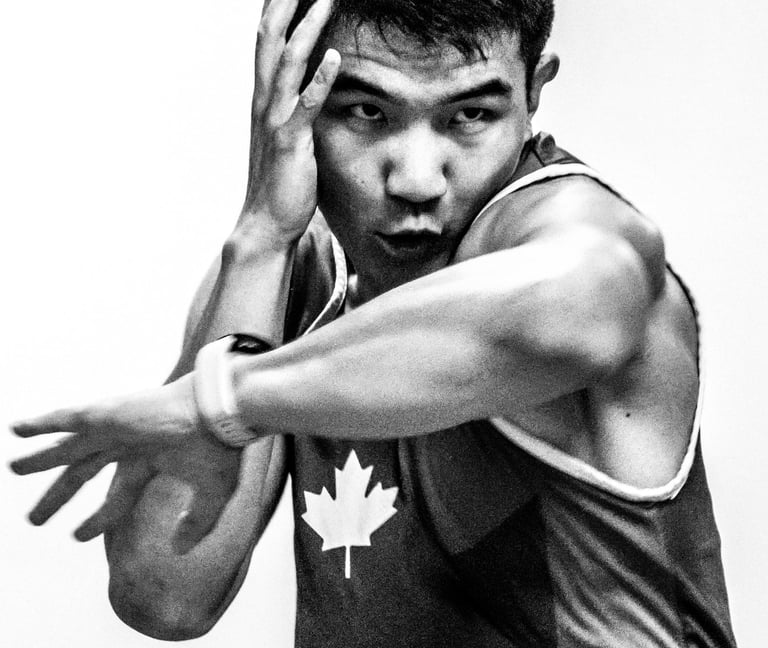 Qianshu has one hand up and his left elbow is striking forward.