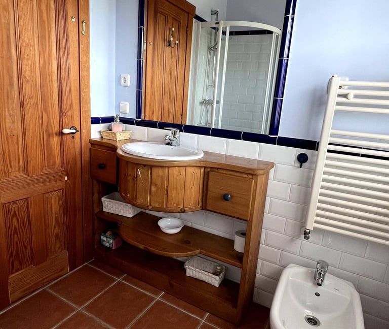 a rustic bathroom with a toilet and a sink
