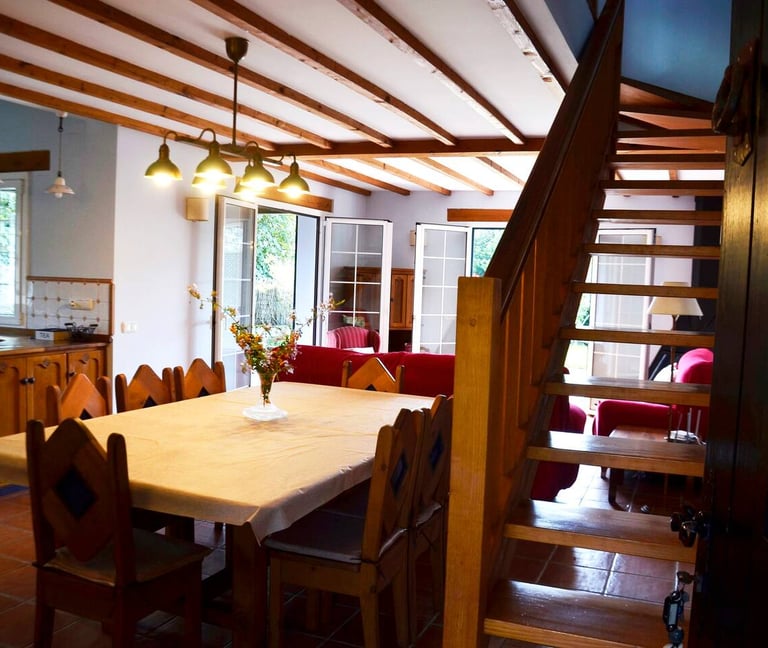 a dining room table with a table and chairs