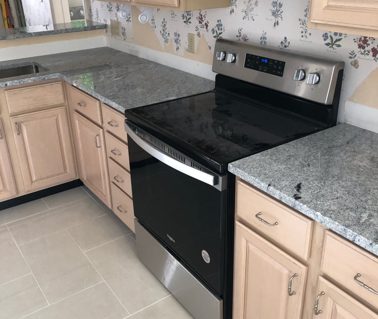 a kitchen with custom herringbone tiling