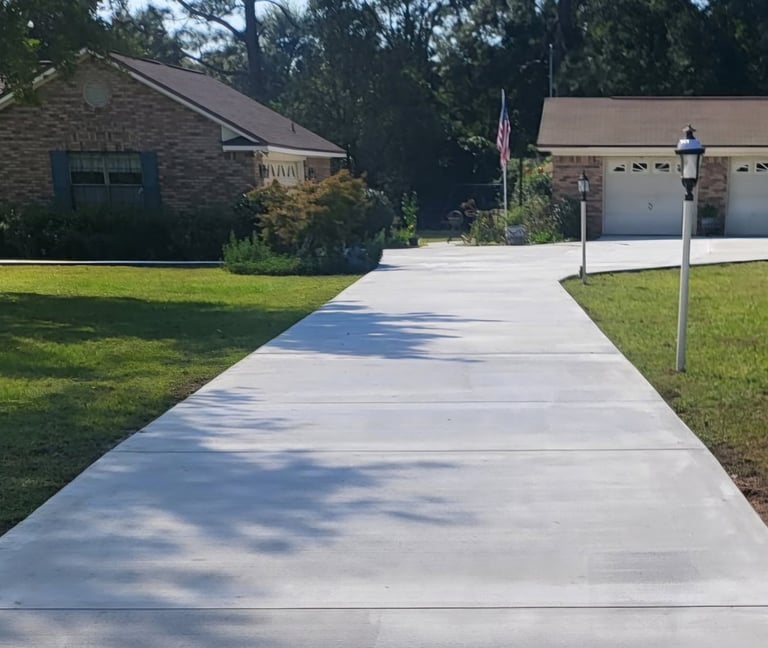 Concrete driveway installation in Pensacola FL with smooth finish and clean edges
