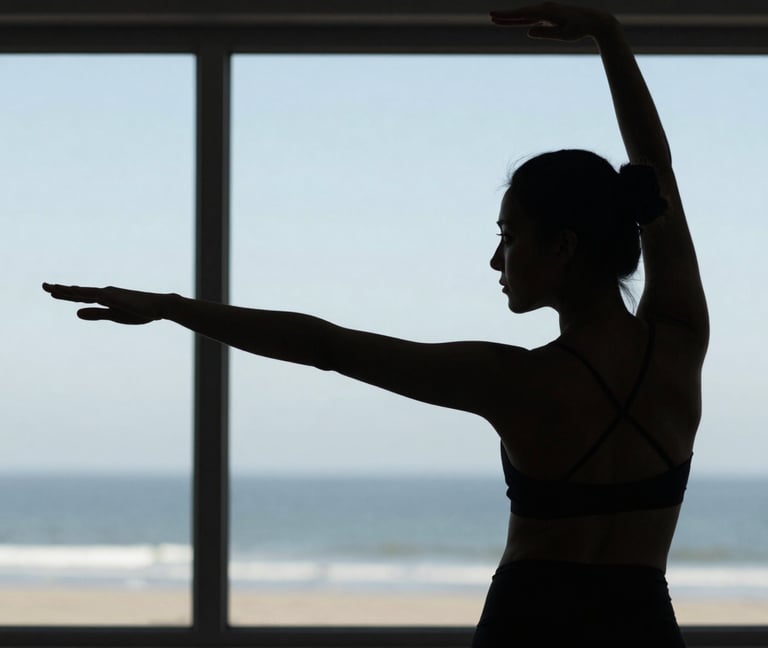Close up of a practitioner's silhouette against a large window in a North American coastal setting. Elegant posture, calm morning light, light blue-grey tones.