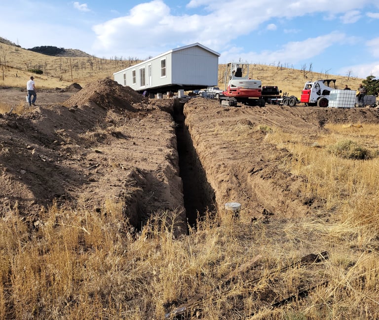 Installing a water line in the mountains of Larimer County Colorado