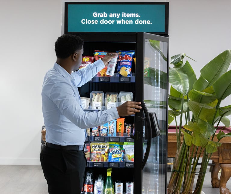 A man using a Micromart™ smart vending machine