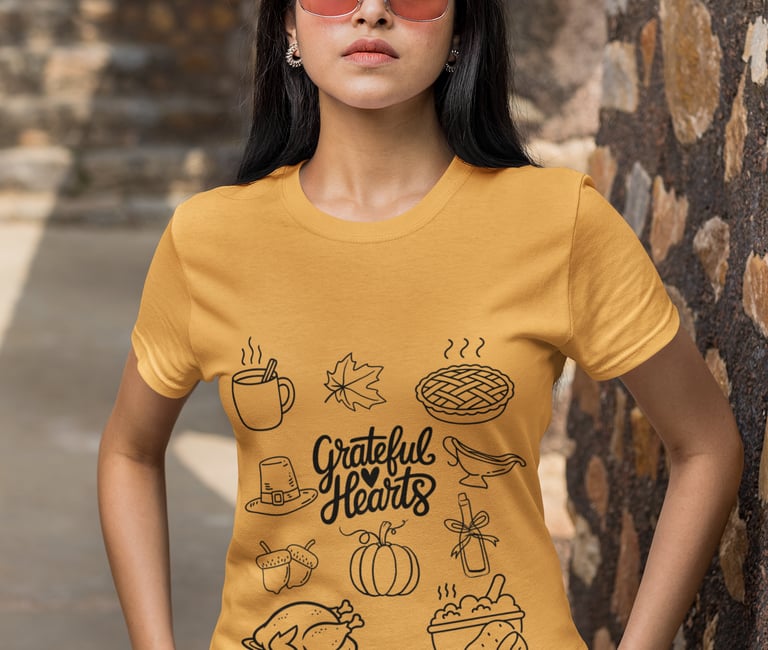 a woman wearing a yellow shirt with a graphic of a woman with a hat and