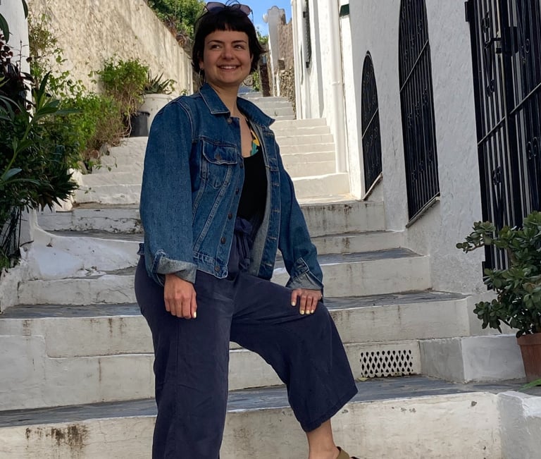 a woman in a denim jacket and jeans jacket
