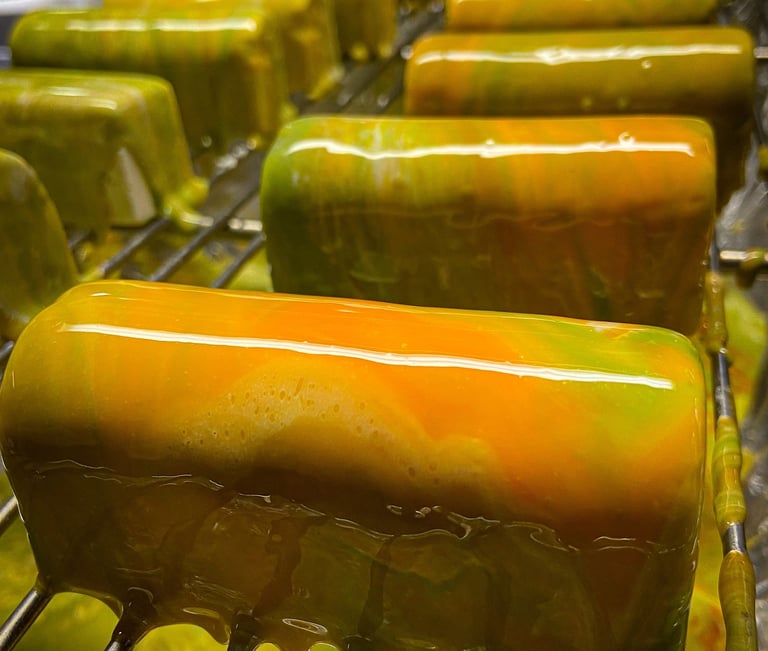 Multicolor glazed entremet with green and orange colours