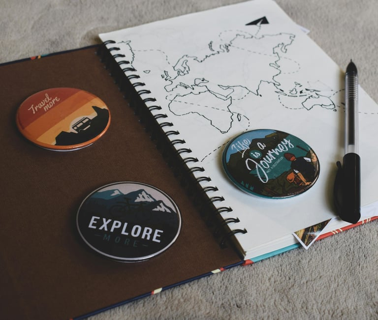 a notebook with a pen and a notebook with a map of the world