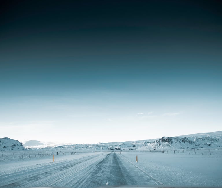 a car driving down a snowy road