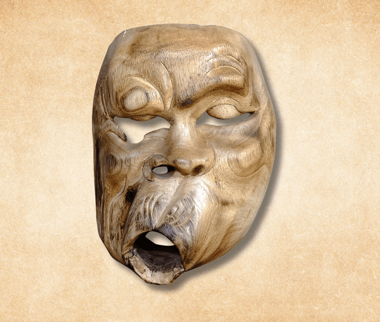 a wooden decoration of mask