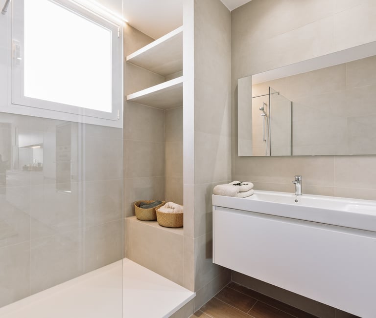 Modern bathroom design with in-built shower and natural stone tiles