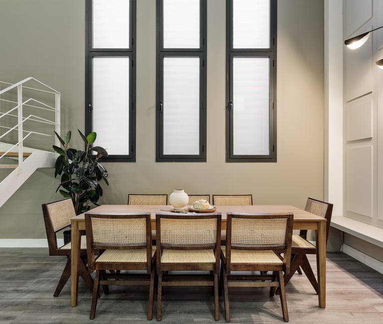 Contemporary dining room with a minimalist design, rattan furniture, neutral colors in Barcelona