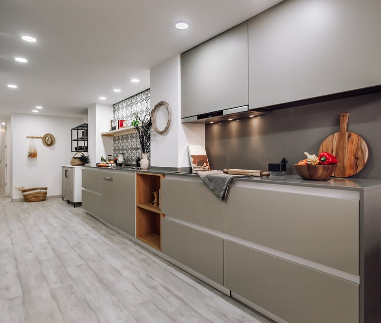 Open-plan kitchen with patterned tiles, neutral tones in Rute apartment interior design
