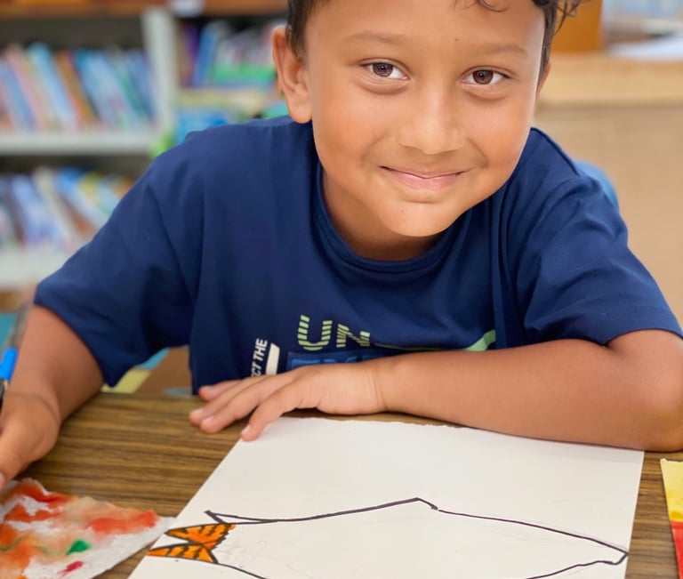 child drawing on watercolor paper