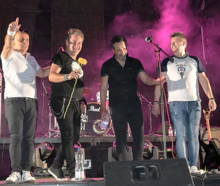 a group of men standing on a stage
