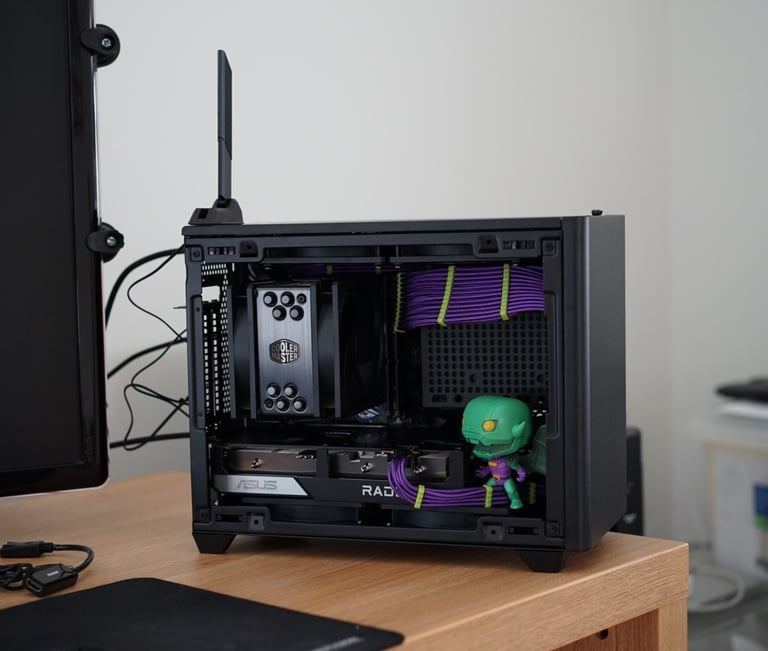 a computer case with a green alien in the middle