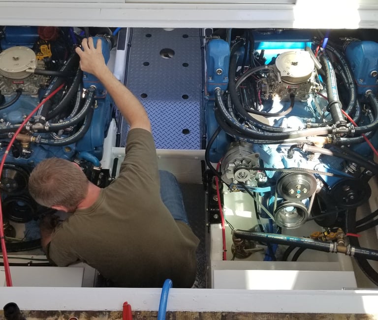 man working in engine room of boat