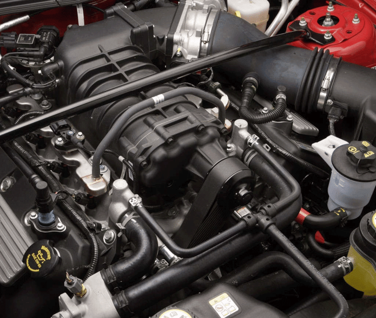 Qualified mobile mechanic performing car diagnostics with state-of-the-art equipment